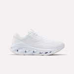 The Reebok Women's Fuel Flex Run Shoes feature a white mesh upper, Fuel Flex midsole with oval cutouts, and white laces for style and comfort. Photographed on a plain light background.