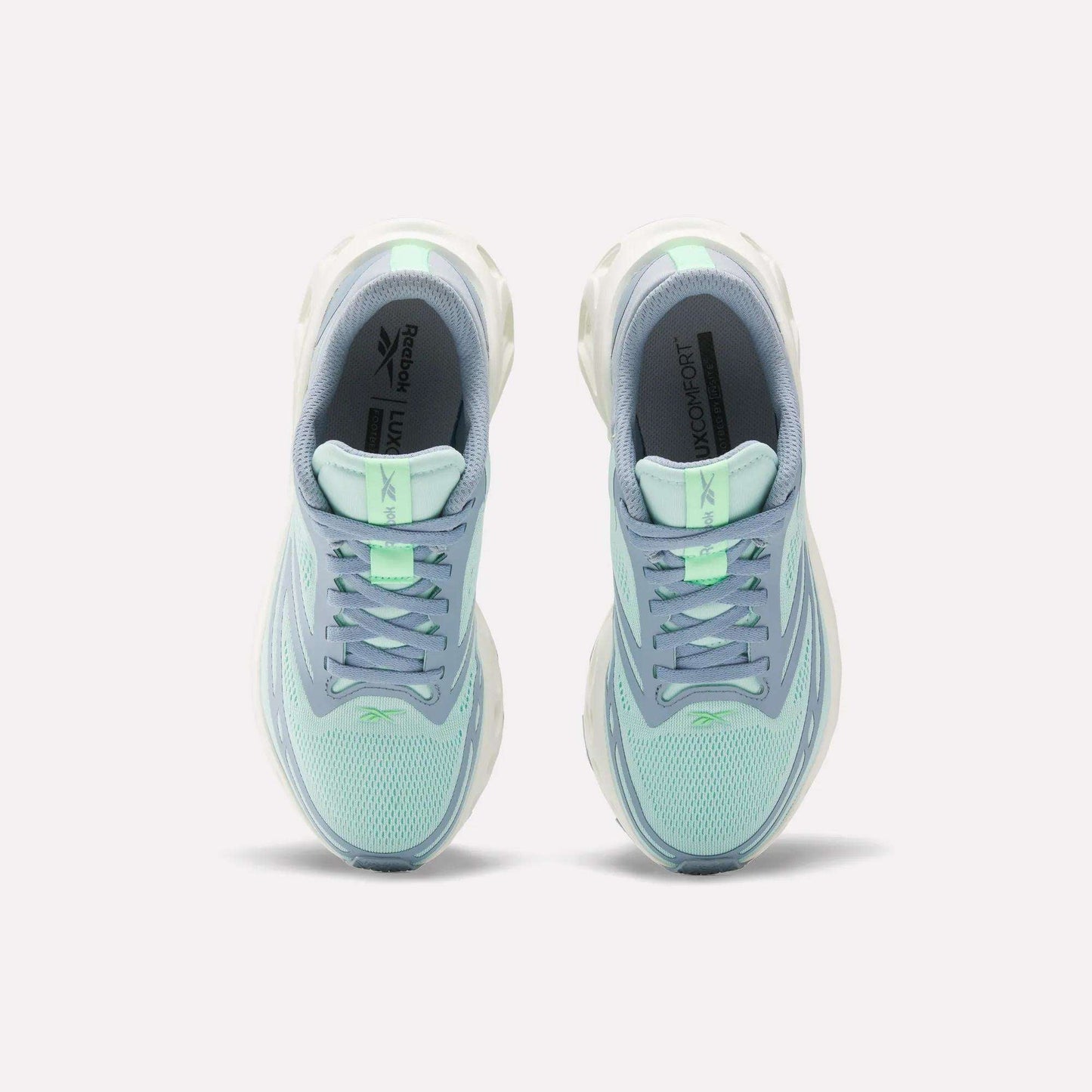 A pair of Women's Fuel Flex Run Shoes by Reebok in light blue and mint green are shown side by side from above, highlighting the laces, mesh uppers, branded insoles, and Fuel Flex midsole for lasting comfort.