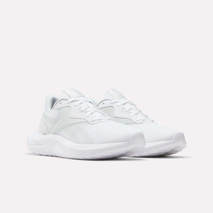 A pair of Reebok Women's Energen Lux Running Shoes with mesh uppers, white laces, and thick white soles is displayed on a plain light background.
