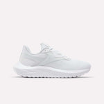 The Reebok Women's Energen Lux Running Shoes feature a white mesh upper, lace-up closure, and a thick textured sole—versatile athletic sneakers showcased on a plain white background.