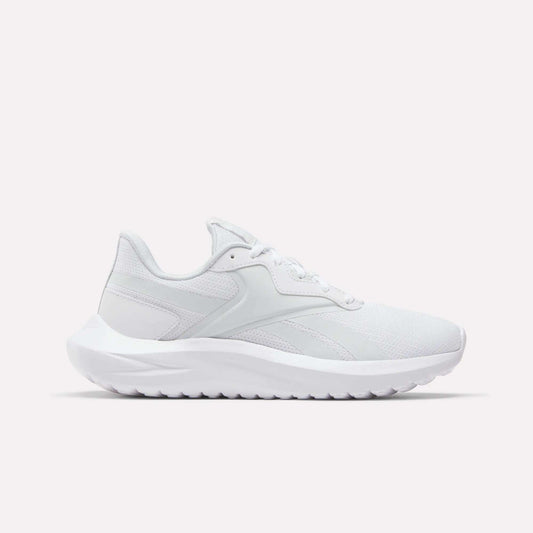 The Reebok Women's Energen Lux Running Shoes feature a white mesh upper, lace-up closure, and a thick textured sole—versatile athletic sneakers showcased on a plain white background.
