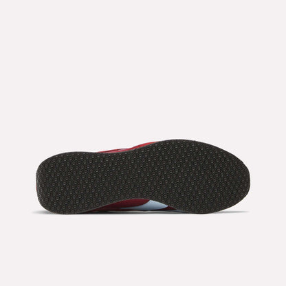 The image shows the bottom view of Reebok R400 Shoes with a black, textured circular rubber sole, and a glimpse of the red and white upper.