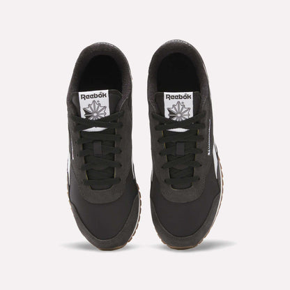 Top view of Classic AZ Shoes by Reebok—black retro running shoes with white tongues displaying the Reebok logo and star, black laces, and gum-colored outsoles—showcasing '70s-inspired style on a white background.