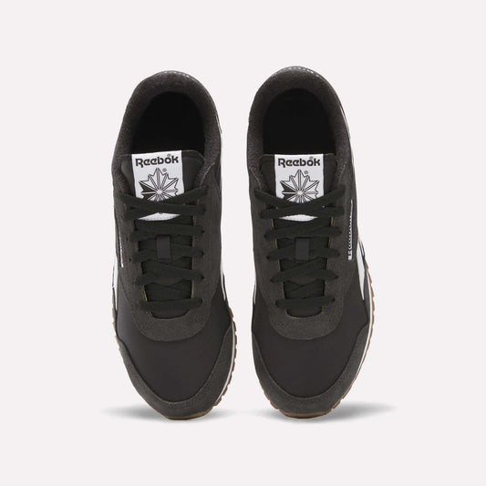 Top view of Classic AZ Shoes by Reebok—black retro running shoes with white tongues displaying the Reebok logo and star, black laces, and gum-colored outsoles—showcasing '70s-inspired style on a white background.