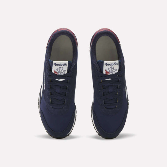 A pair of Reebok Classic AZ Shoes in navy blue, shown from above with laces, white tongue tags bearing the Reebok logo, and white rubber soles on a plain background—evoking classic retro running style.