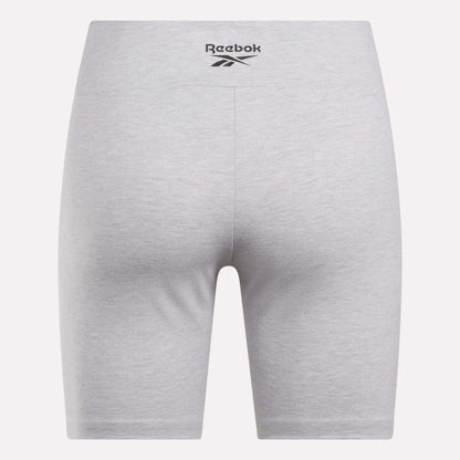 Back view of Women's Small Logo Cycle Shorts by Reebok in light gray, featuring a black logo on the waistband. These cotton-rich shorts offer a snug, stretchy fit with no visible seams or pockets for a sleek, comfortable look.