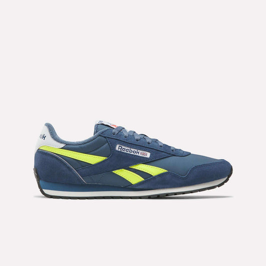 The Reebok Classic AZ Shoes in blue feature yellow accents and a white sole, displayed in side profile against a plain white background. '70s-inspired design details and the Reebok logo appear on the side and heel.