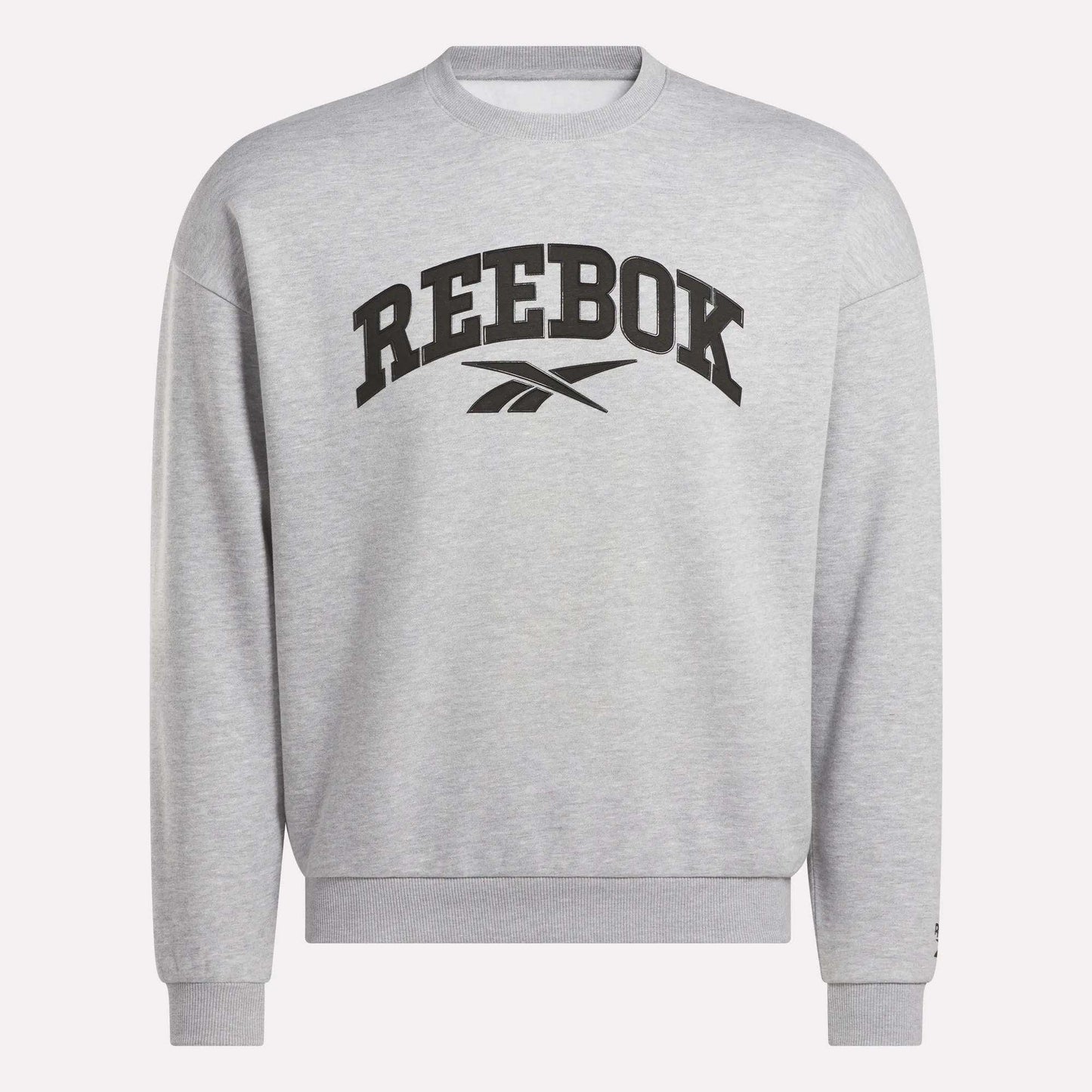 The Reebok Men's Cottle Sweatshirt is light grey with a black Reebok logo and brand name on the chest. This crewneck features long sleeves, ribbed cuffs and hem, and provides a relaxed, casual fit.