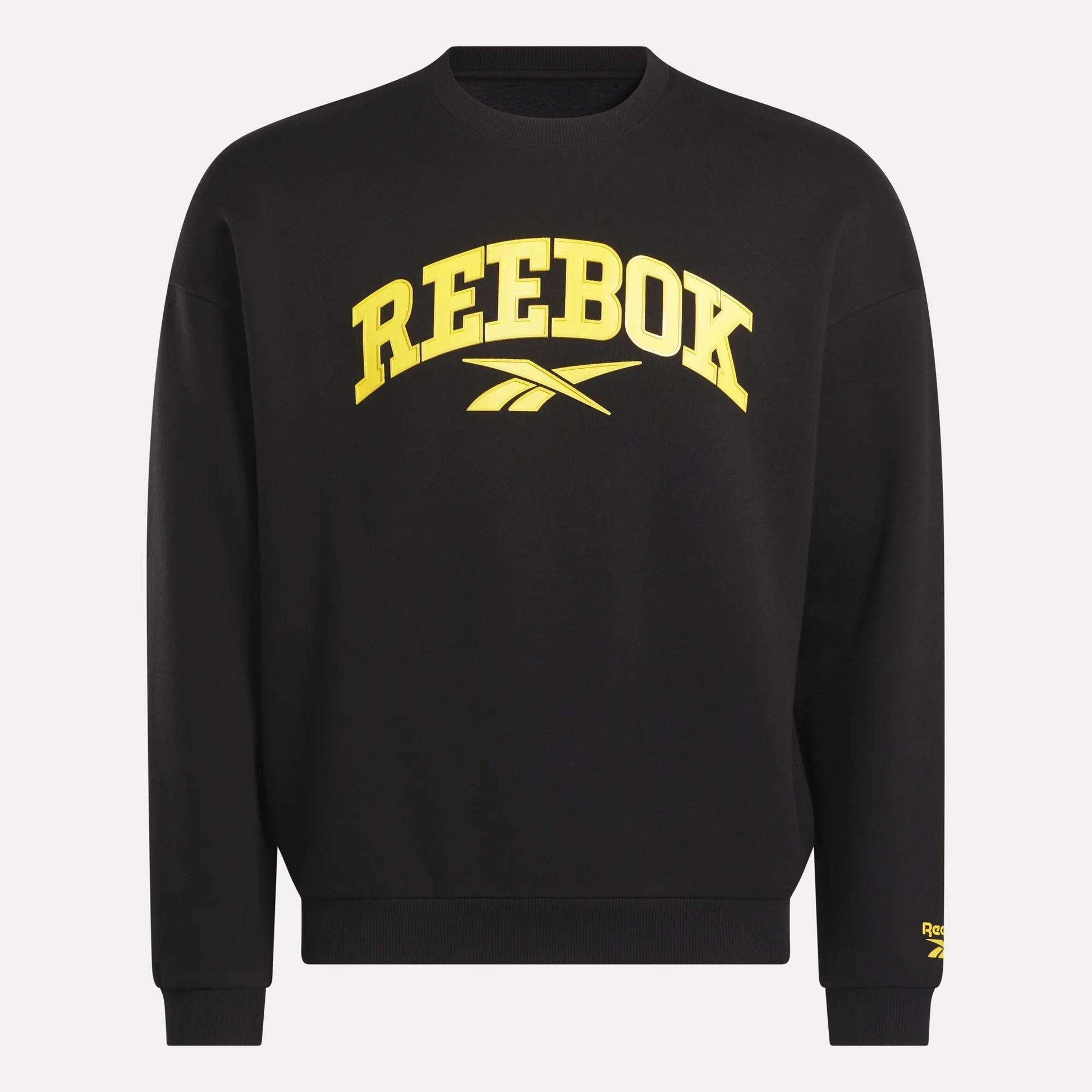 The Reebok Men's Cottle Sweatshirt is black with bold yellow "REEBOK" lettering and logo on the front, plus a small yellow Reebok logo on the lower left sleeve.