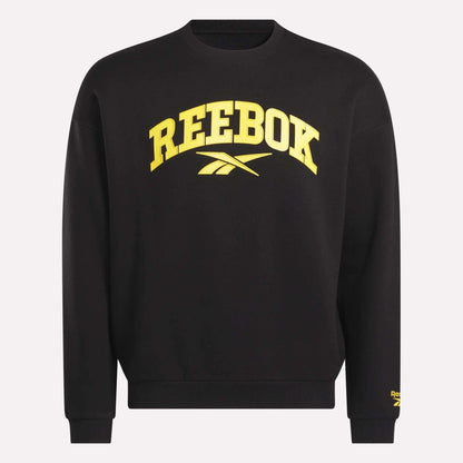 The Reebok Men's Cottle Sweatshirt is black with bold yellow "REEBOK" lettering and logo on the front, plus a small yellow Reebok logo on the lower left sleeve.