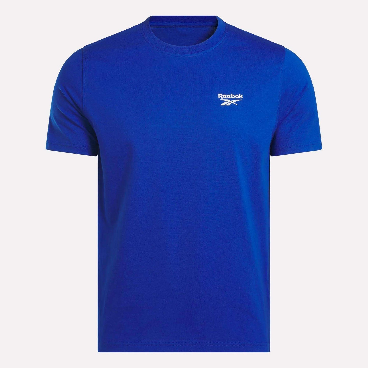 The Reebok Men's Small Logo Crewneck Short Sleeve T-Shirt, shown on a white background, features soft cotton jersey fabric and a small white Reebok logo with text on the left chest.