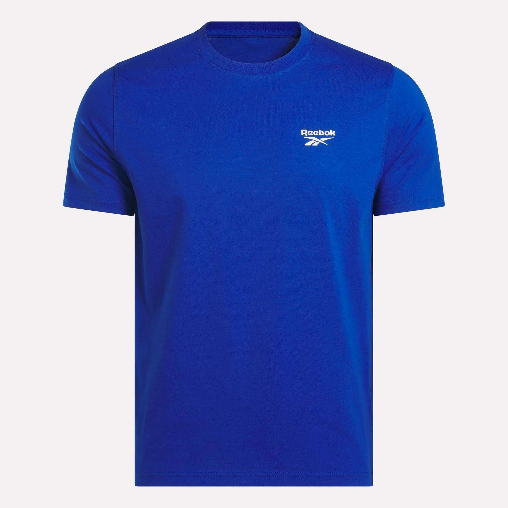 The Reebok Men's Small Logo Crewneck Short Sleeve T-Shirt, shown on a white background, features soft cotton jersey fabric and a small white Reebok logo with text on the left chest.
