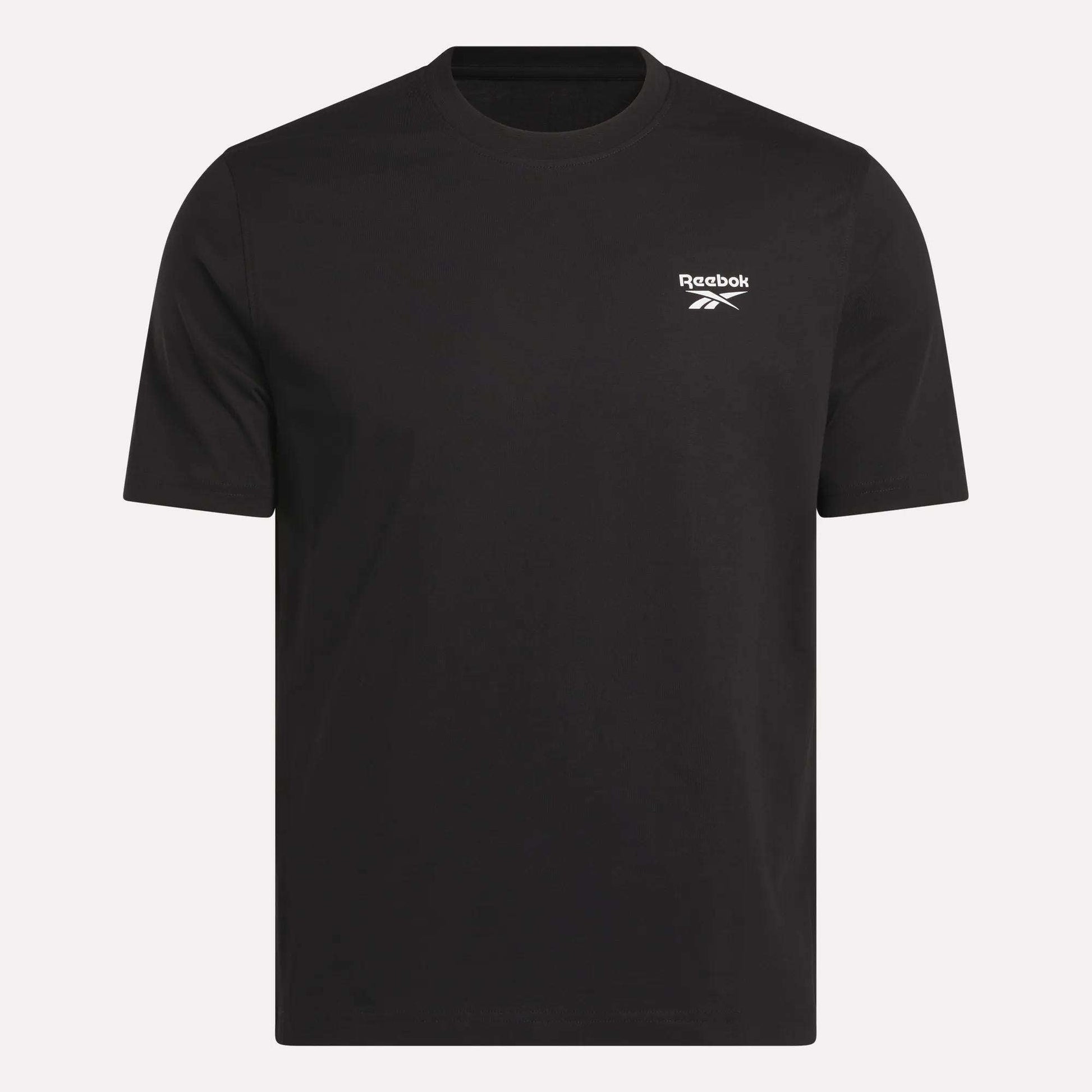 The Reebok Men's Small Logo Crewneck Short Sleeve T-Shirt is a plain black cotton jersey tee, featuring short sleeves and a small white Reebok logo on the upper left chest, shown against a light background.
