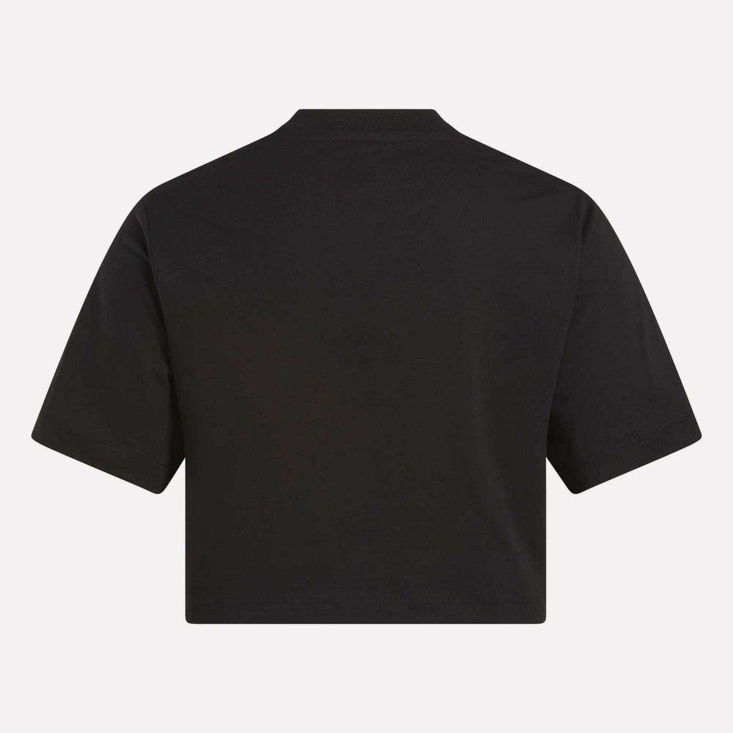 A Reebok Women's Two-Color Logo Crew Cropped Short Sleeve Tee, shown from the back, features a loose fit and short sleeves without visible designs—ideal for everyday comfort.