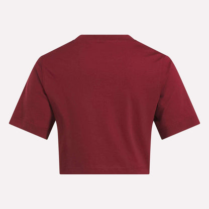 A Reebok Women's Two-Color Logo Crew Cropped Short Sleeve Tee is shown from the back against a white background.