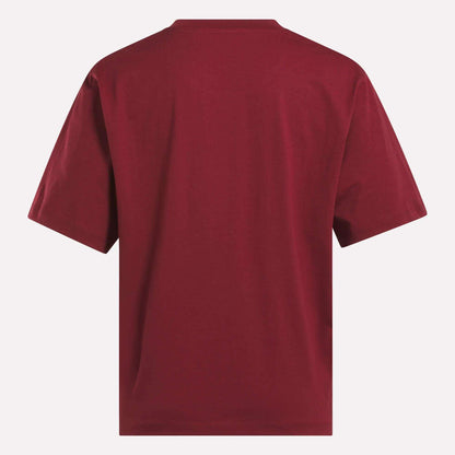 A Women's Big Logo Oversized Crew Short Sleeve Tee by Reebok in plain maroon, shown from the back against a white background.