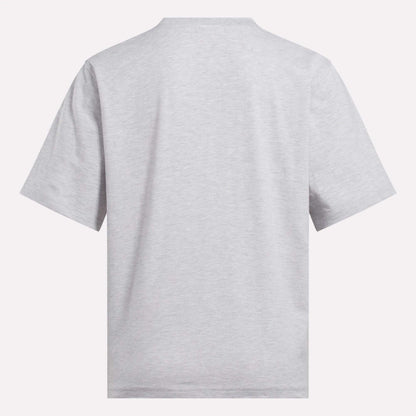The Reebok Women's Big Logo Oversized Crew Short Sleeve Tee is shown from the back in light gray, featuring an oversized fit and simple crew neckline against a white background, with no visible designs or logos.