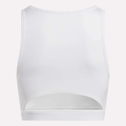 The Reebok Women's Core High-Impact Bra is a white, sleeveless sports bra with a high neckline and horizontal lower-back cut-out. Made with sweat-wicking fabric to keep you cool and dry during intense workouts. Shown from the back.
