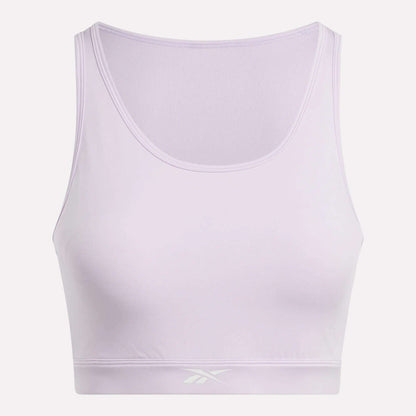 The Women's Core High-Impact Bra by Reebok is a light purple sleeveless crop top with a scoop neckline and subtle front waistband logo. Featuring sweat-wicking fabric, it's ideal for high-impact training. Shown on a white background.