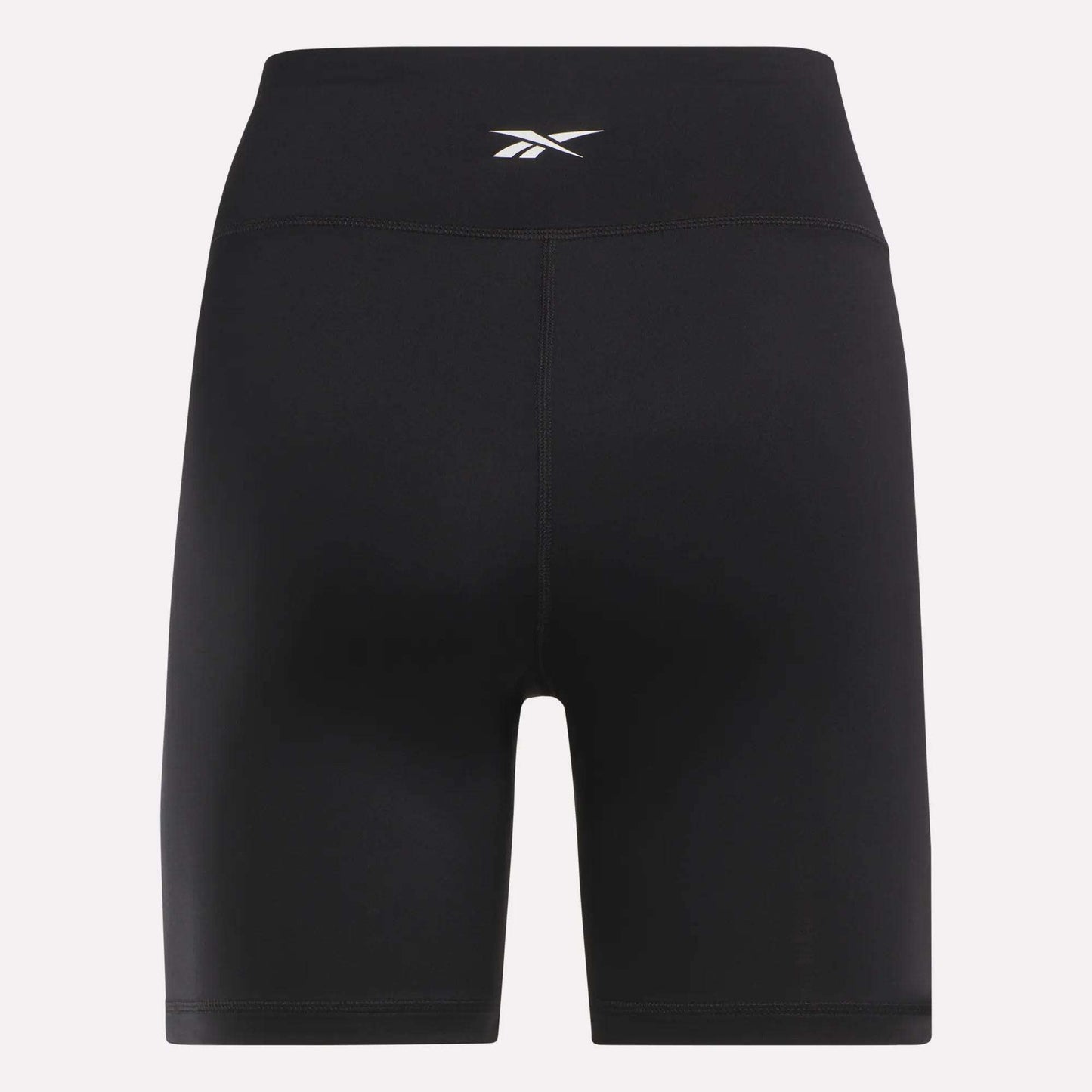 Reebok Women's Core High-Rise Cycle Shorts feature a small white logo on the waistband. Made from smooth, stretchy, sweat-wicking fabric, they're perfect for cycling or workouts. Shown against a plain light background.