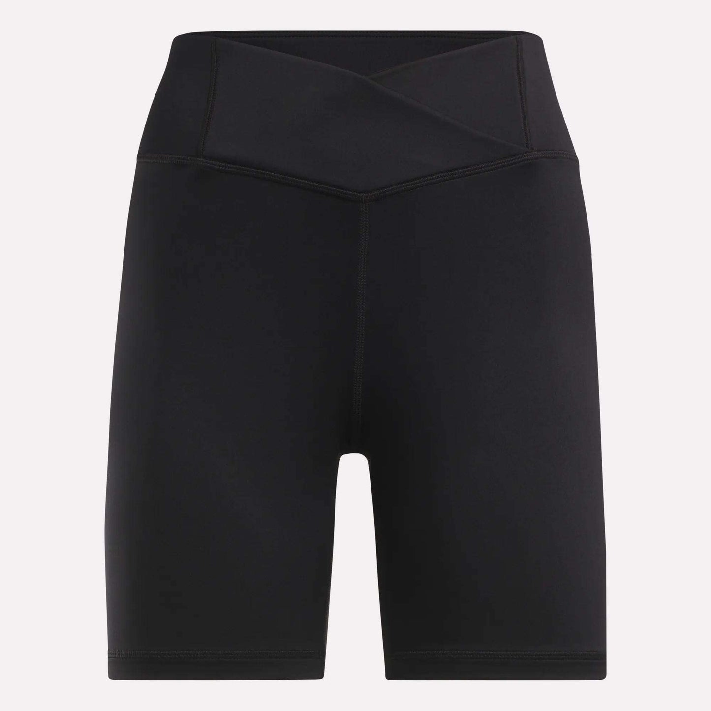 Reebok Women's Core High-Rise Cycle Shorts feature a black, sweat-wicking fabric, crossover waistband, and mid-thigh length. Displayed on a plain light background.