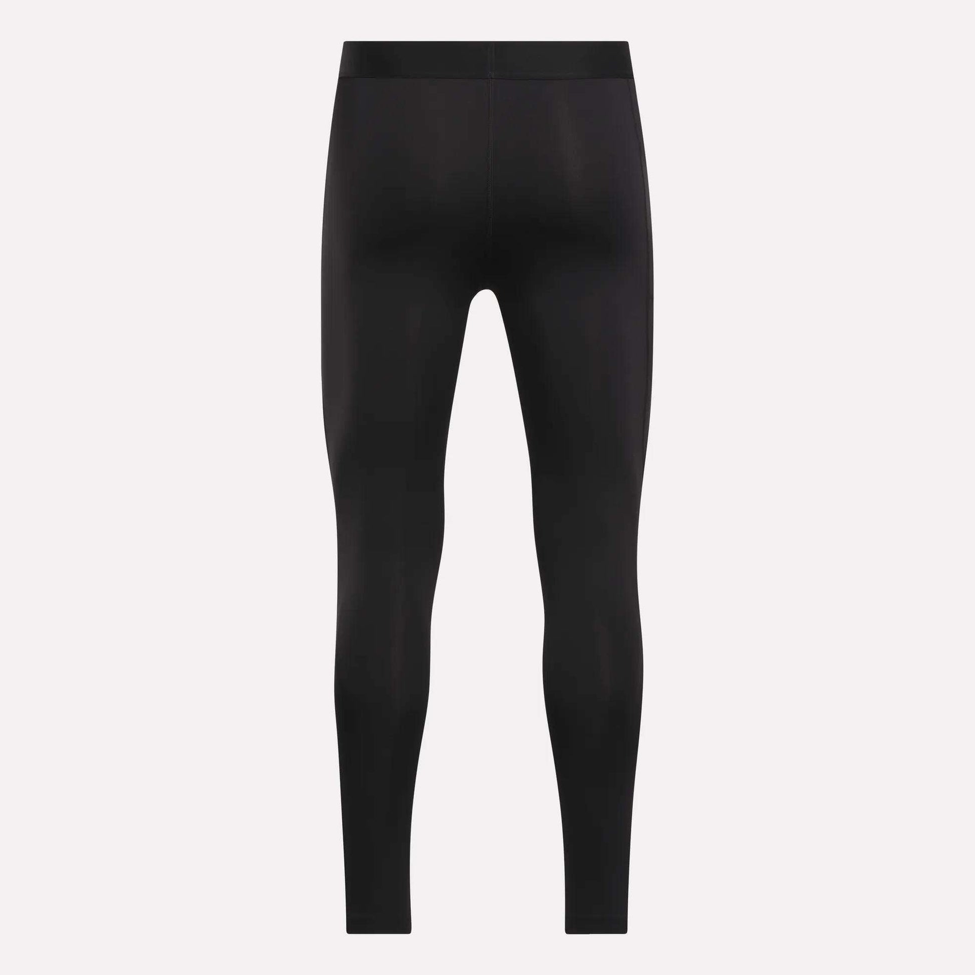 The Reebok Men's Core Training Tights are black, full-length, and fitted, shown front-facing on a plain white background with no visible logos or designs. These sweat-wicking leggings are ideal for intense workouts.