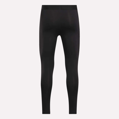 The Reebok Men's Core Training Tights are black, full-length, and fitted, shown front-facing on a plain white background with no visible logos or designs. These sweat-wicking leggings are ideal for intense workouts.