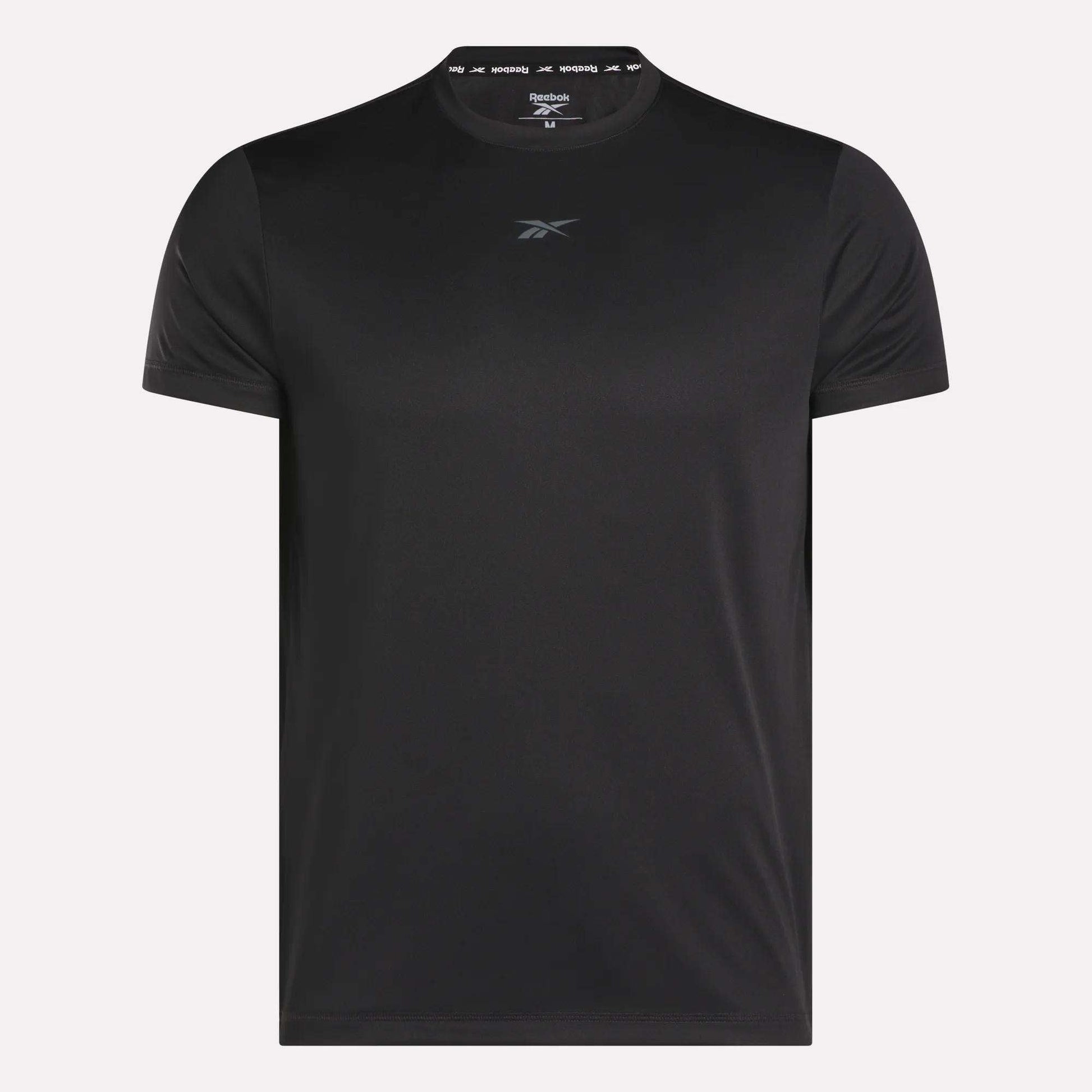 The Men's ID Train Short Sleeve Tech Tee by Reebok is a plain black tech tee with RBK-DRY fabric and a small front center chest logo, shown against a white background.
