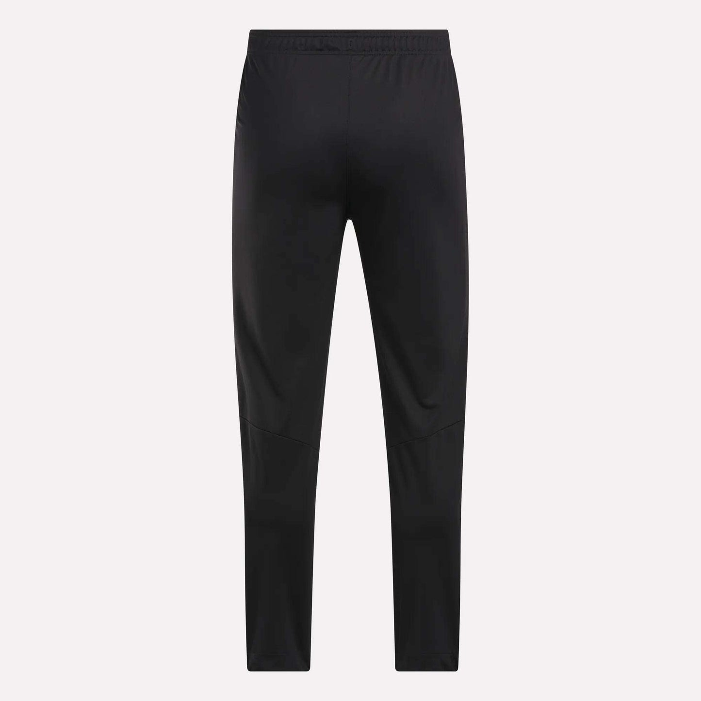 Men's Train Knit Pants by Reebok shown from the back, featuring a slim fit and elastic waistband, set against a plain light background.