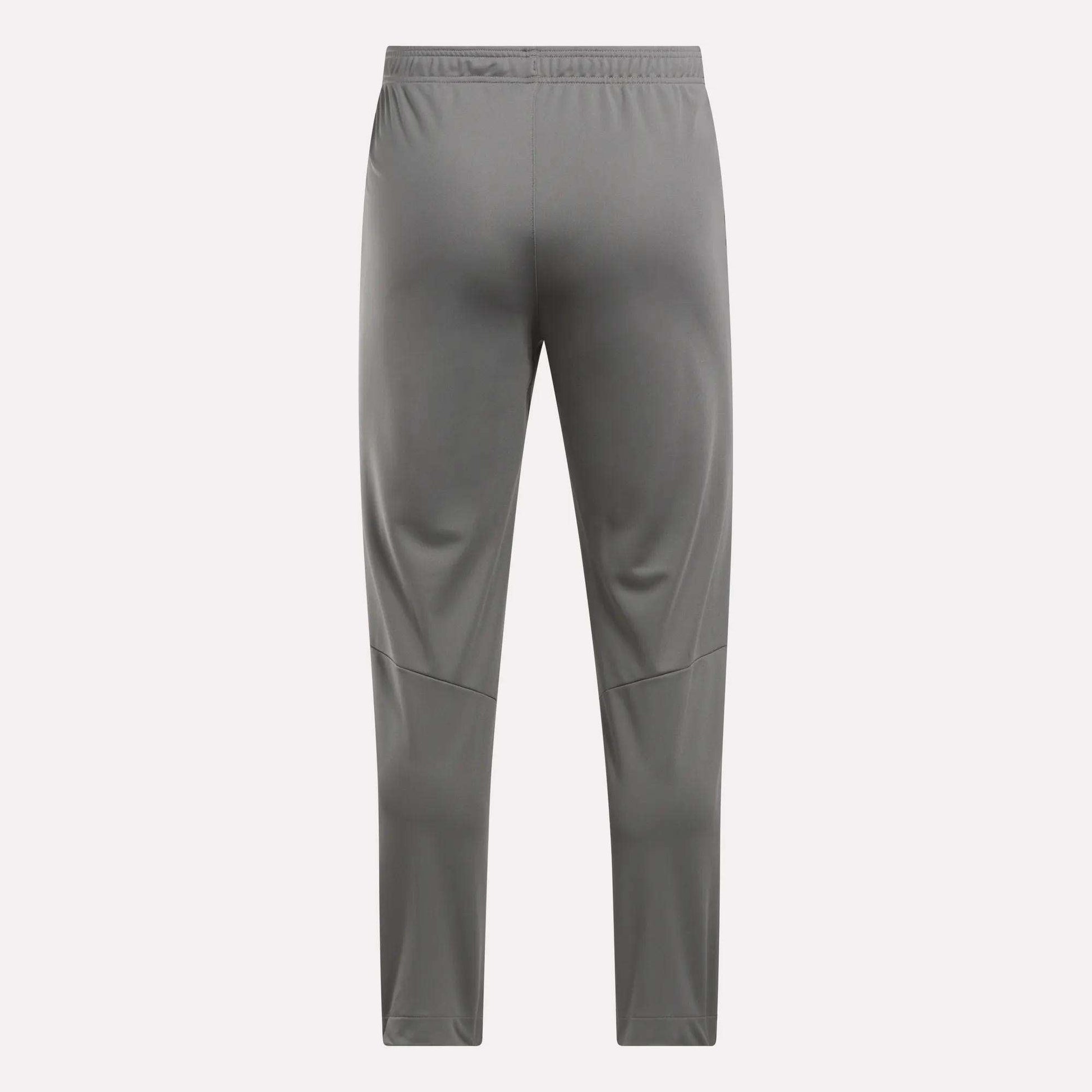 Back view of Reebok Men's Train Knit Pants in gray, featuring an elastic waistband and subtle leg seam details, shown against a plain light background.