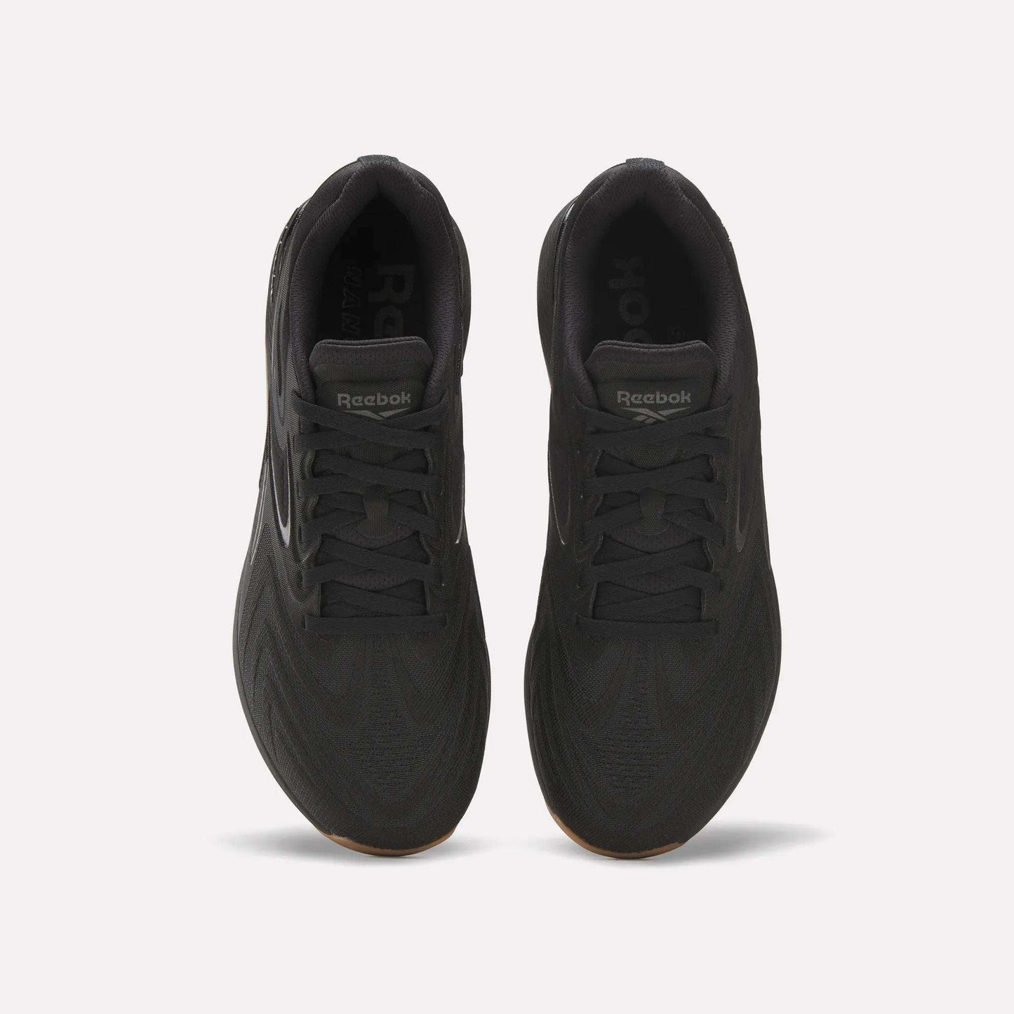Top view of Reebok Nano X5 Edge Training Shoes in black, featuring Flexweave uppers, laces, a tongue with Reebok branding, and a textured pattern designed for superior support and performance.