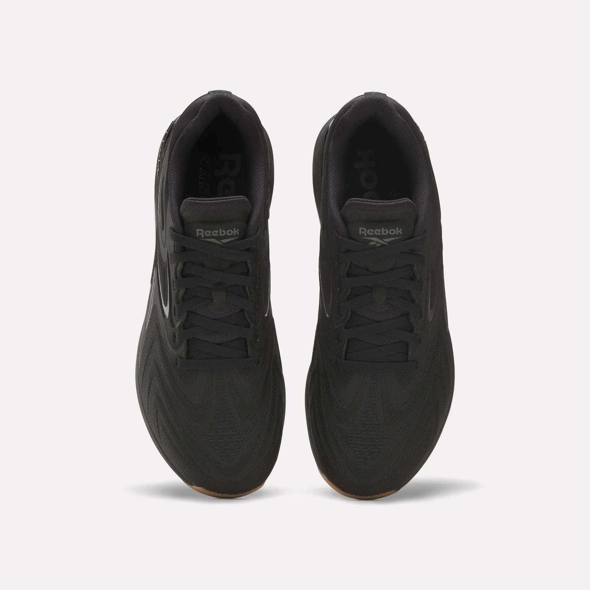 Top view of Reebok Nano X5 Edge Training Shoes in black, featuring Flexweave uppers, laces, a tongue with Reebok branding, and a textured pattern designed for superior support and performance.