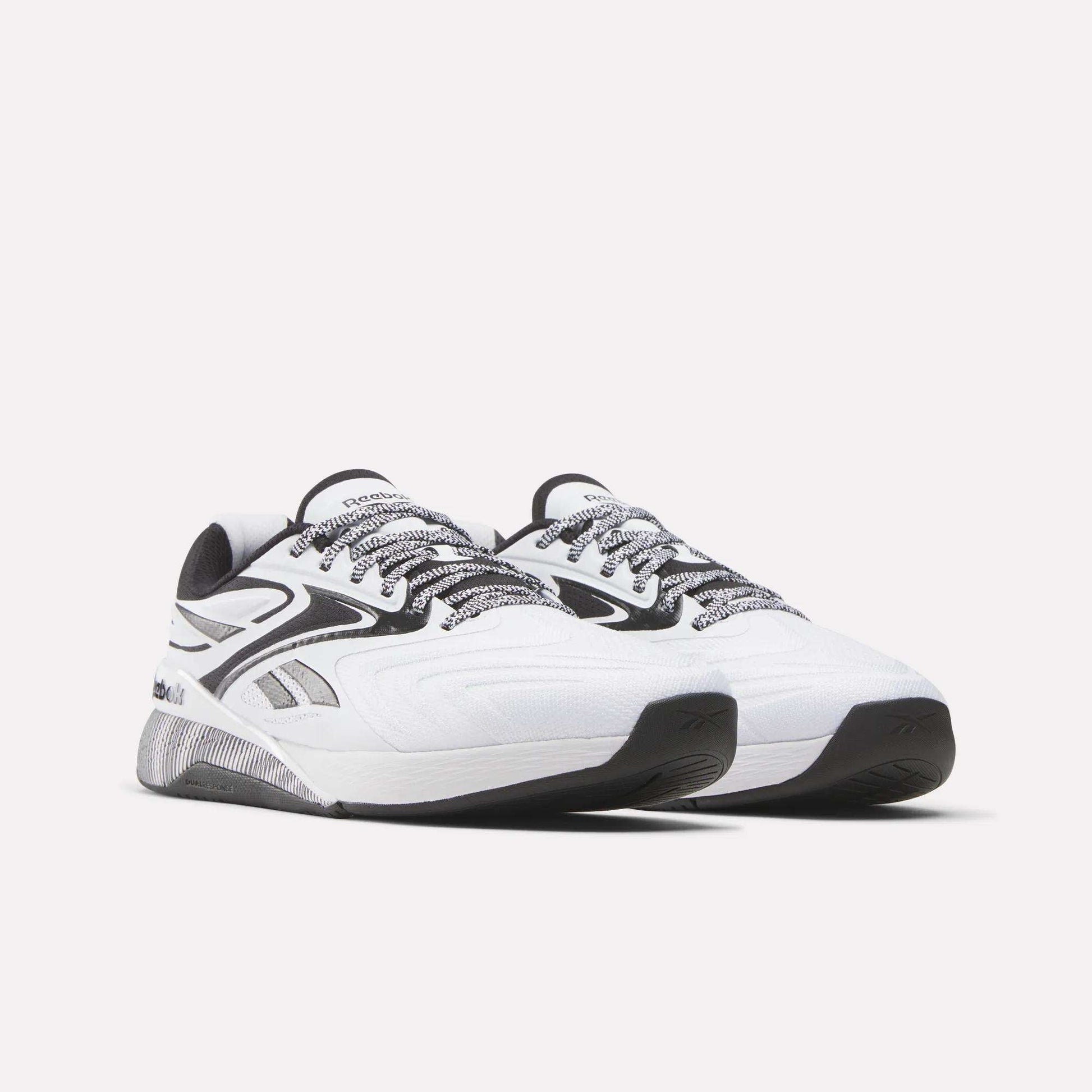 Reebok Nano X5 Edge Training Shoes in white with black and gray accents feature black-and-white patterned laces and a textured sole, shown on a plain light background for peak performance.