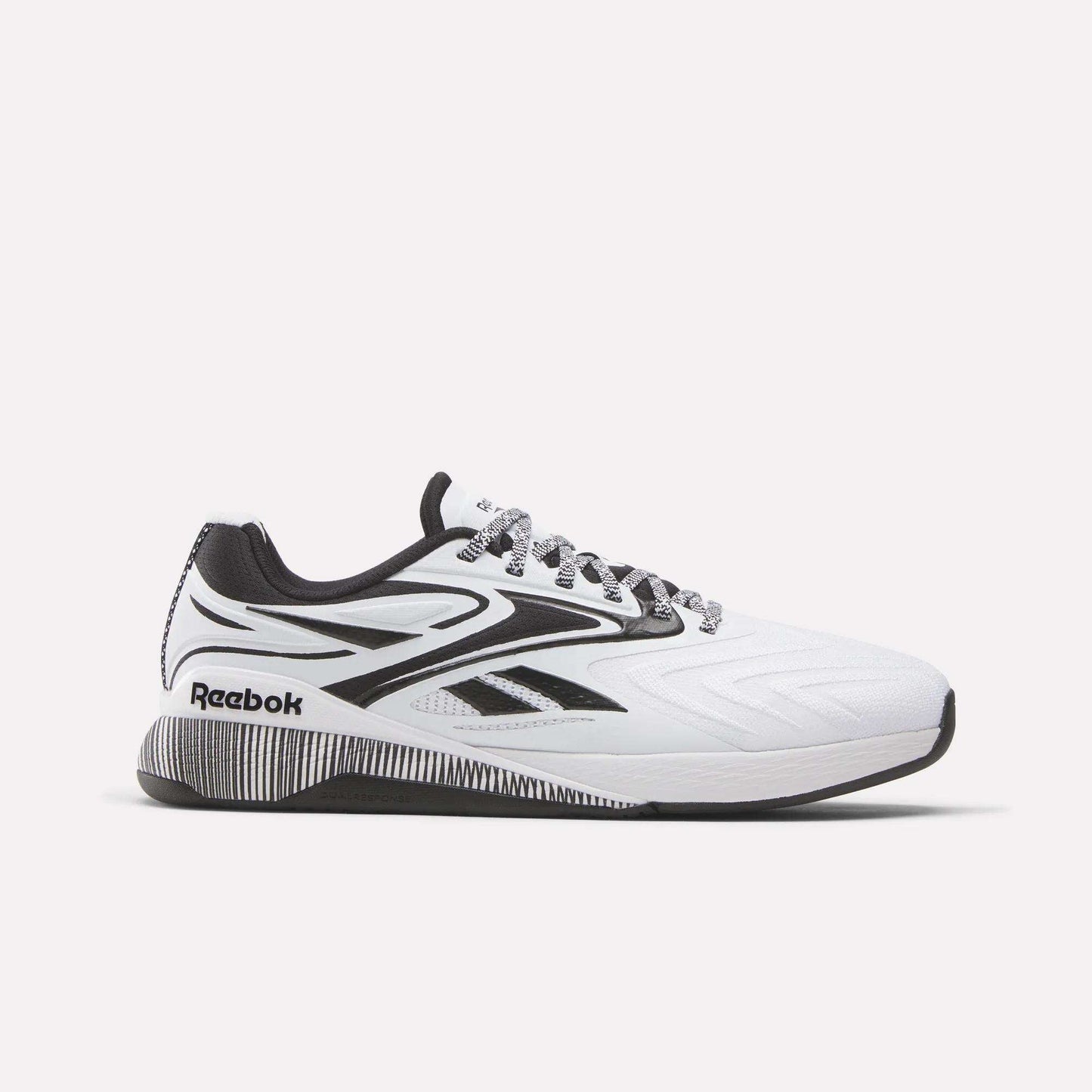 The Reebok Nano X5 Edge Training Shoes feature a white and black design with a black sole, black and gray laces, and Reebok logos on the side and heel. Engineered for peak performance, they're displayed on a plain white background.