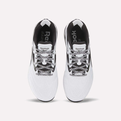 Top view of Reebok Nano X5 Edge Training Shoes in white with black accents, black-and-white laces, and visible Reebok logos on the insoles and tongue, set against a plain white background.