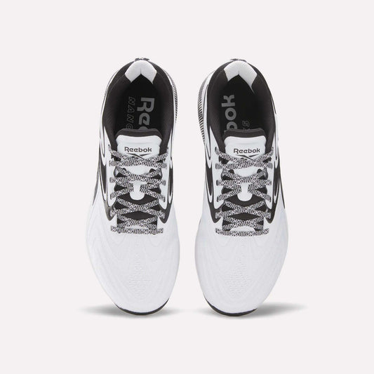 Top view of Reebok Nano X5 Edge Training Shoes in white with black accents, black-and-white laces, and visible Reebok logos on the insoles and tongue, set against a plain white background.