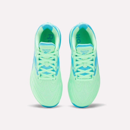 Top view of Women's Nano X5 Edge Training Shoes by Reebok in neon green with light blue accents, laces, and lining, shown side by side on a white background—perfect for your next HIIT class.