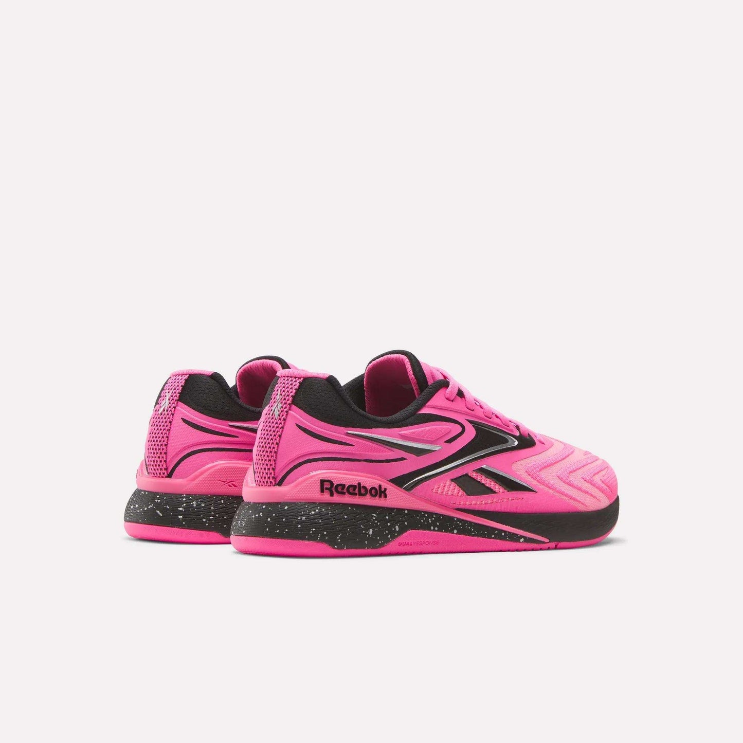 The Women's Reebok Nano X5 Edge Training Shoes feature a vibrant pink design with black accents and soles, plus the iconic Reebok logo on the side and heel. Shown on a white background—ideal for your next HIIT class.