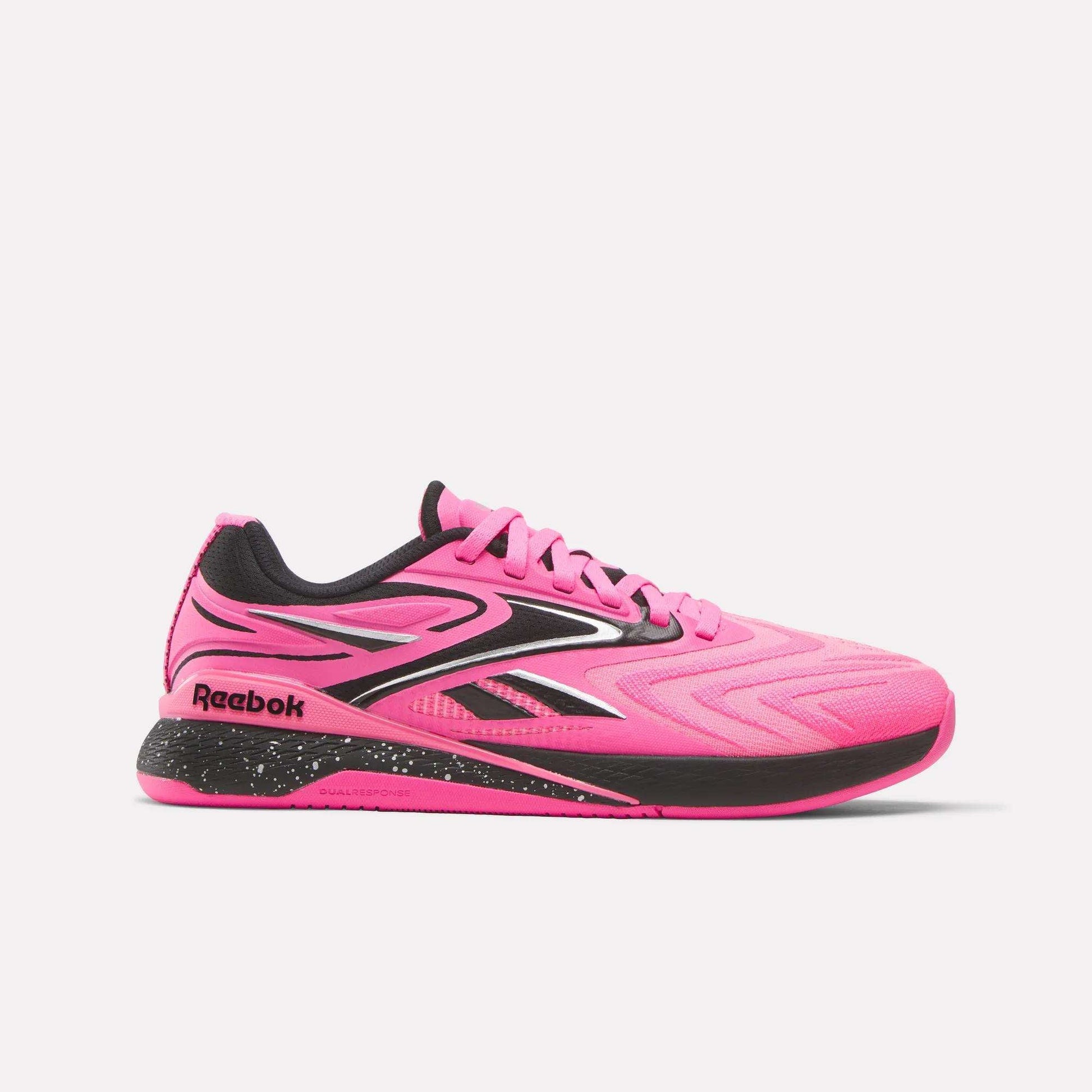 The Reebok Women's Nano X5 Edge Training Shoes feature a bright pink design with black and white accents, speckled midsole, lace-up closure, and Reebok logos—ideal for your next HIIT class.