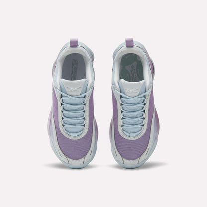 Top view of Reebok Women's DMX Series 3000 Training Shoes with light purple mesh uppers, white soles, and pale blue laces, featuring DMX 3 Technology for cushioned comfort—all side by side on a plain white background.