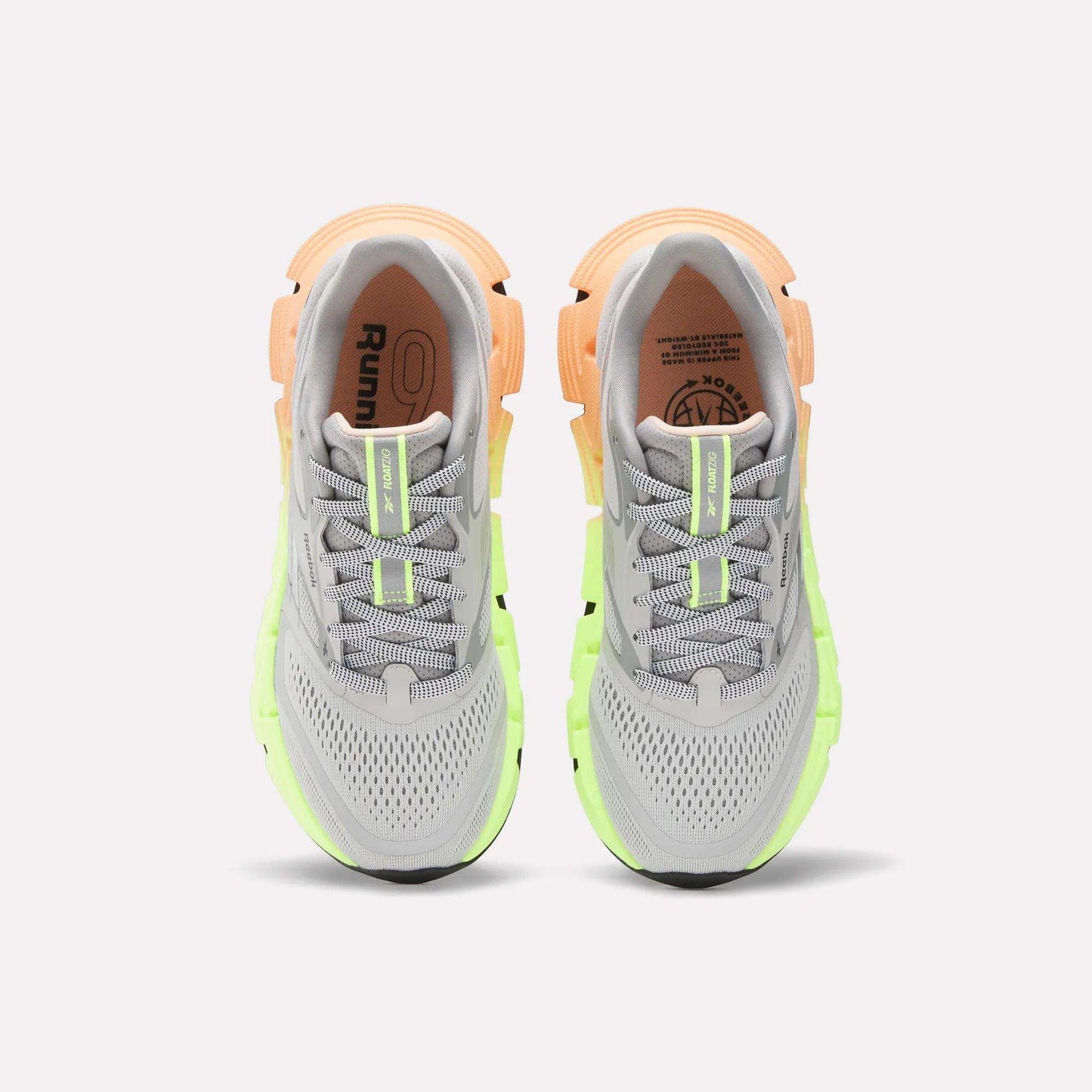 The Reebok Women's FloatZig 2 Running Shoes feature gray mesh uppers, neon green and peach accents, laces, and cushioned Superfloat+ soles, shown from above.