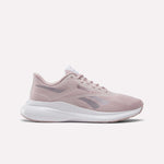 The Reebok Women's Energen Run 4 Running Shoes in Muted Mauve/White feature a breathable mesh upper, lace-up closure, white sole, and subtle Reebok logos on the side and tongue.