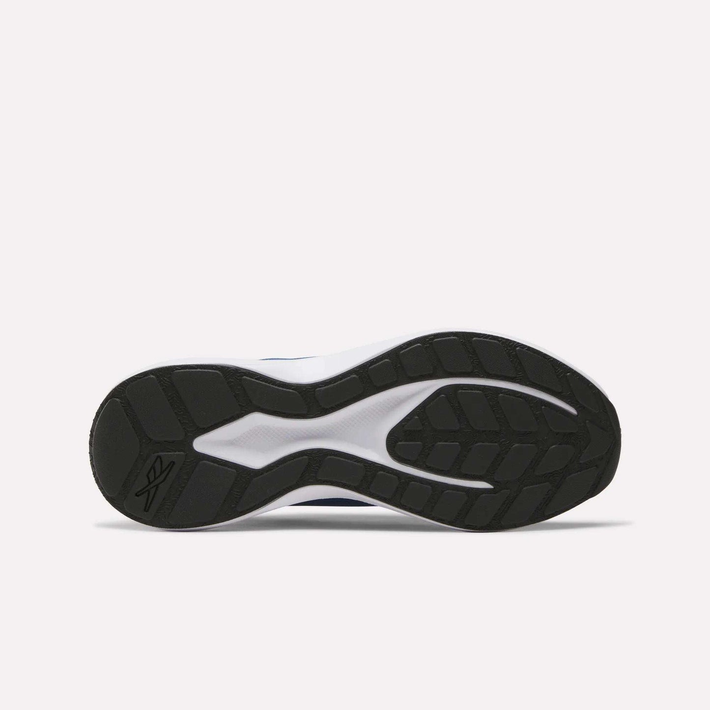 The image shows the black rubber outsole of Reebok Men's Energen Run 4 Running Shoes, featuring a patterned tread and white FuelFoam midsole accents. The lightweight shoe is displayed sole-up against a plain white background.
