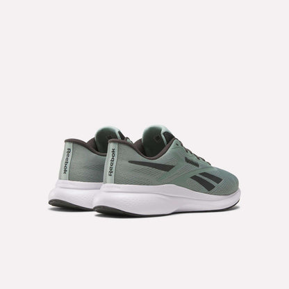 A pair of Men's Energen Run 4 Running Shoes by Reebok in green with black accents and white soles, featuring a lightweight design and breathable mesh upper, are shown on a light background at an angle to display side and back details.