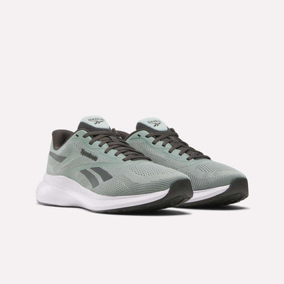 Men's Energen Run 4 Running Shoes by Reebok, in light green with black and white accents, feature a breathable mesh upper and cushioned white FuelFoam midsole, shown on a plain white background.