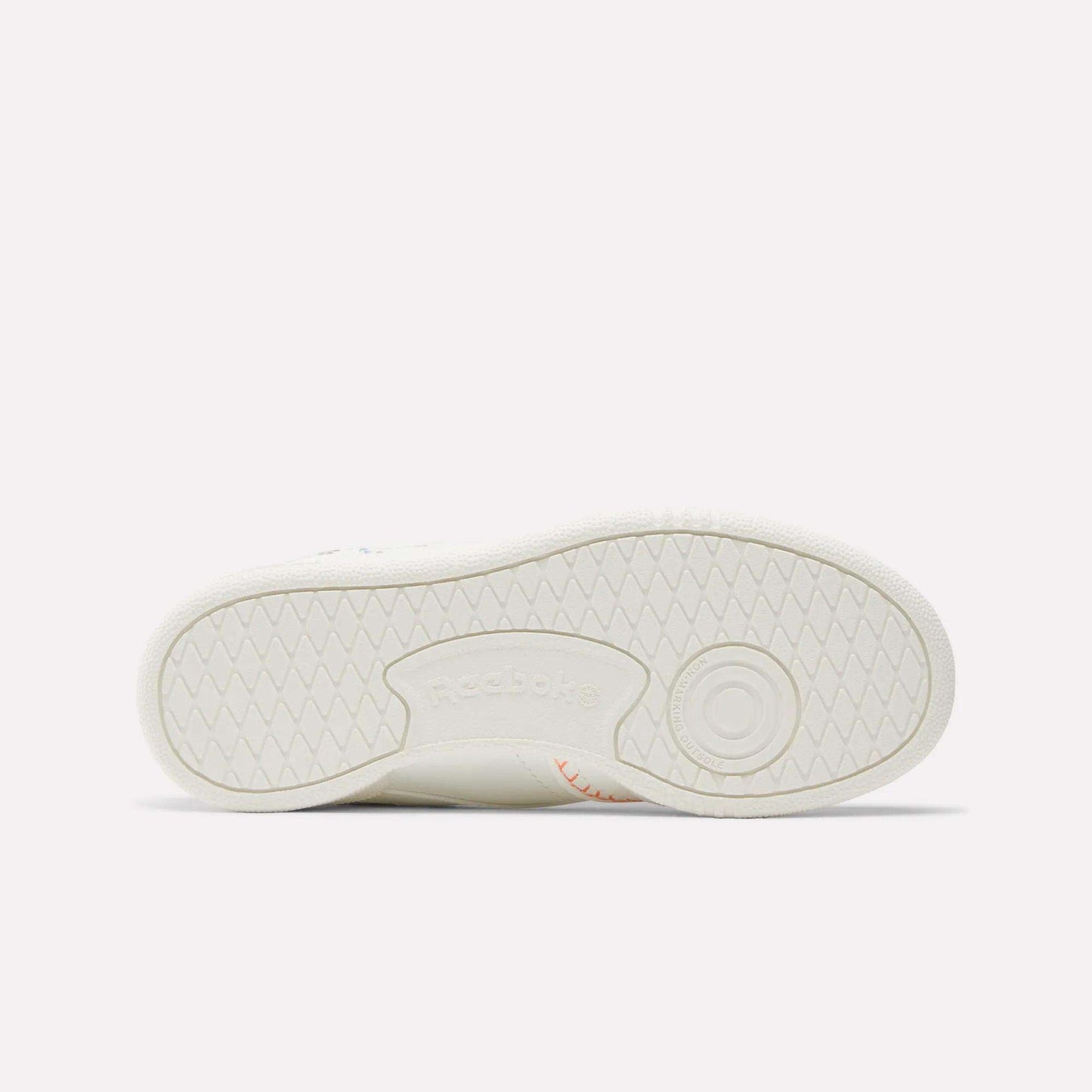 The image shows the sole of the Reebok x DORA Club C Shoes for little kids, laid flat to display the tread pattern and an embossed Reebok logo at the center.