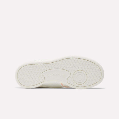 The image shows the sole of the Reebok x DORA Club C Shoes for little kids, laid flat to display the tread pattern and an embossed Reebok logo at the center.