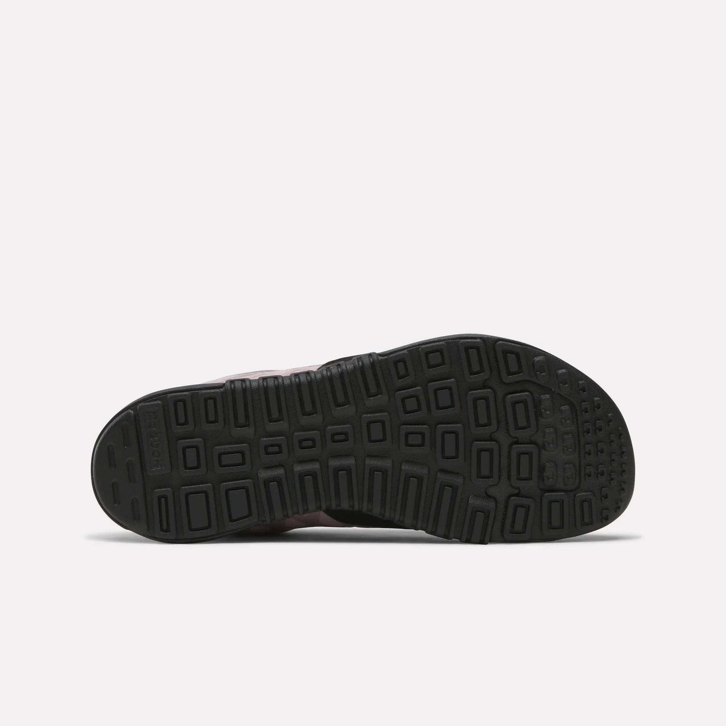 The image displays the black rubber sole of Reebok Women's Nano 2.0 Training Shoes, featuring a geometric tread pattern with squares and rectangles. The shoe is shown sole up on a plain light background—ideal for functional fitness.