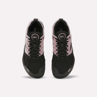 The Reebok Women's Nano 2.0 Training Shoes are shown from above with black mesh toes, black laces, light pink sides, and visible Reebok logos on the tongue and insole—ideal women's training shoes for functional fitness.