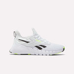 The Reebok Women's Nano Gym Training Shoes feature a chunky sole, black and neon yellow accents, a mesh upper, lace-up closure, and bold black logo—perfect cross-training shoes for weight training. Shown against a white background.